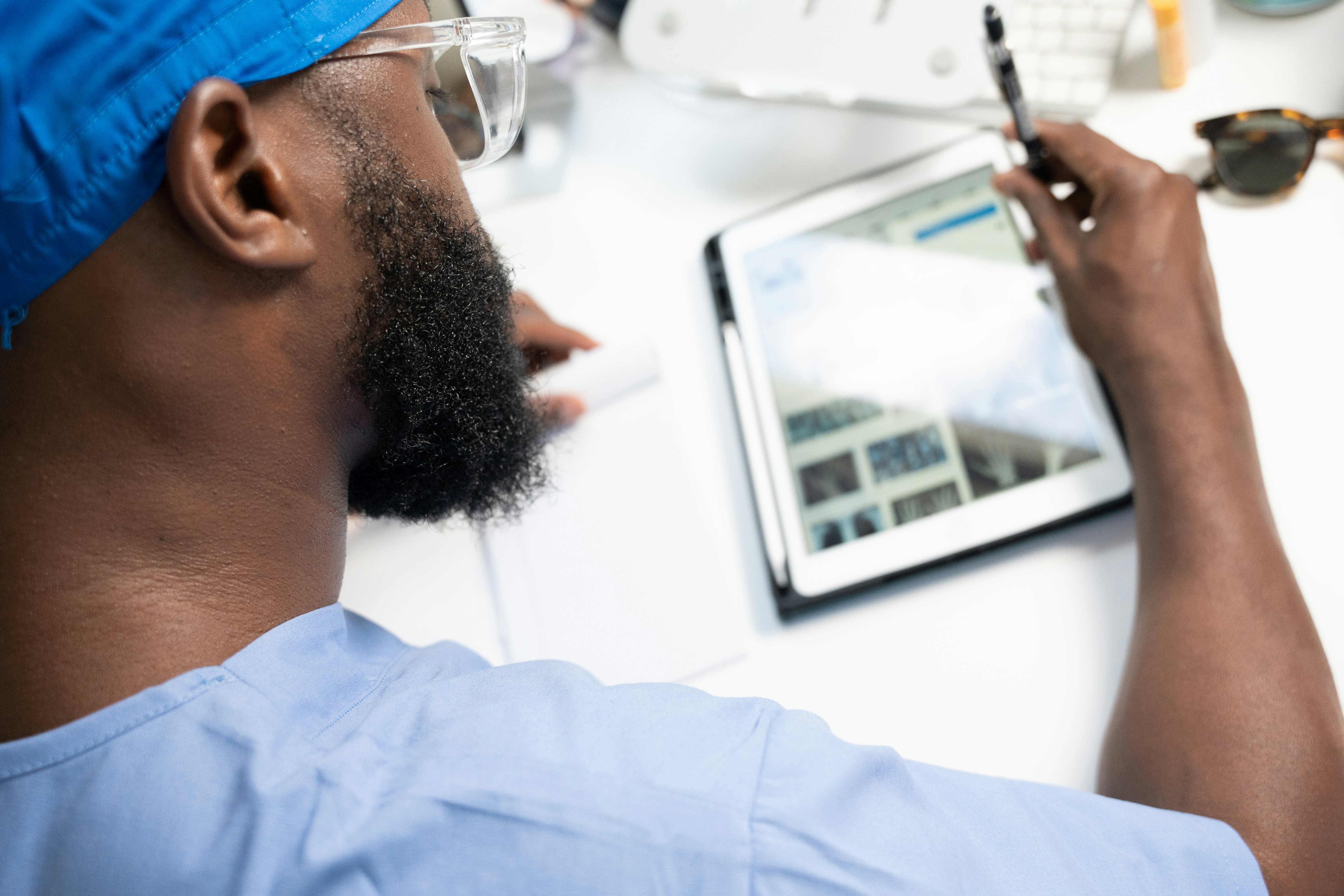 Clinician using scheduling app on a tablet